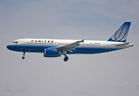 N455UA @ KSFO - On final for one of the 28's. Too much grain ? Due the full 500 mm of my Sigma (on a tripod). - by Philippe Bleus