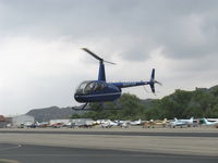 N993AB @ SZP - 2009 Robinson R44 RAVEN II, Lycoming IO-540 derated to 245 Hp for 5 minutes, 205 Hp continuous, crossing over Rwy 22 to refuel - by Doug Robertson