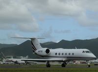 N487QS @ TNCM - taxing runway 10 - by daniel jef