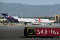 N282FE @ KRNO - A veteran of the skies, this Boeing 727 taxies to the Fed Ex cargo ramp after its morning arrival at Reno-Tahoe International. - by Gary Schenauer