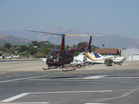 N441NC @ SZP - 2005 Robinson R44 RAVEN II, Lycoming IO-540 derated to 245 Hp for 5 min., 205 Hp cont., hover over SZP's helipad - by Doug Robertson