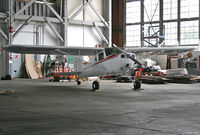 N89676 @ KWWD - Tucked in the corner of cavernous hangar at NAS Wildwood, accompanied by Naval museum pieces, was this lovely little Cessna 140. - by Daniel L. Berek