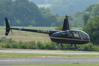 G-DMRA @ EGBS - Robinson R44 II at Wolverhampton Business Airport - by Terry Fletcher