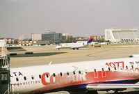 N975EV @ CVG - with N695CA at the gate - by J.B. Barbour