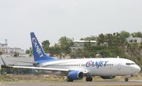 C-FXGG @ TNCM - taxing runway 10