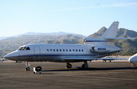 N8200E @ KPSP - Emerson Electric Falcon 900, N8200E on the Signature ramp KPSP - by Mark Kalfas