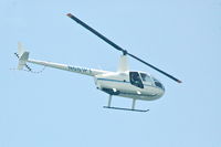 N681PT - Chopper flies along Tamarack Beach, Carlsbad - by John Bryant