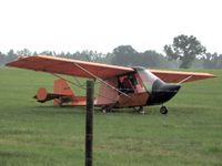 N9116R - Sitting In Hayfield in Levy County, Florida - by Chris Rogers