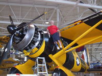 C-GCWL @ CYHM - Crewman is dwarfed by the beast-it has 50' wings, 870 HP, and a 12'6 prop- a real Piper Cub  on Steroids