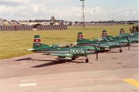 HB-HMC @ EGVA - Pilatus PC-7 of Team Ecco with other team aircraft at the 1991 Intnl Air Tattoo at RAF Fairford. - by Peter Nicholson