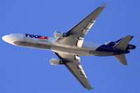 N574FE @ KLAX - FedEx MD-11F, N574FE Departing 25L KLAX - by Mark Kalfas