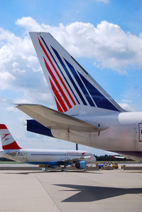 EI-UNZ @ LOWW - Tail of Transaero Boeing 777-200 - by Hannes Tenkrat