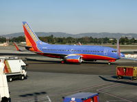 N414WN @ LAX - Southwest 2001 Boeing 737-7H4 in new colors with winglets taxiing (salute by colleagues winglet) - by Steve Nation