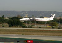 N416QX @ LAX - Horizon 2001 Bombardier DHC-8-402 landing in haze - by Steve Nation