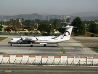 N433QX @ LAX - Horizon 2008 Bombardier DHC-8-402 turning onto runway 24L - by Steve Nation