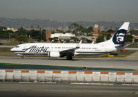 N596AS @ LAX - Alaska 2008 Boeing 737-890 rolling on RW 24L - by Steve Nation