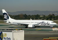 N596AS @ LAX - Alaska 2008 Boeing 737-890 taxiing RW 24L - by Steve Nation