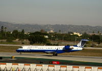 N758SK @ LAX - United Express 'Explus' 2005 Bombardier CL-600-2C10 in latest colors rolling on RW 24L - by Steve Nation