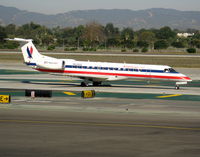 N828AE @ LAX - American Express 2002 Embraer EMB-135KL taxiing to RW 24L - by Steve Nation