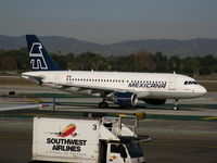 XA-MXJ @ LAX - Mexicana Airbus A-319-112 racing Southwest Airlines food service truck - by Steve Nation