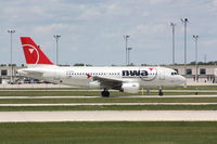 N338NB @ GRR - NWA370 - KGRR-KDTW - Taxi For Departure RWY 26L - by Mel II