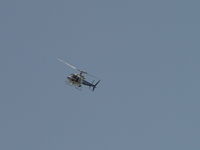 N30NT @ ONT - Orbiting a crime scene in Ontario north of the airport - by Helicopterfriend