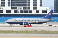 N379UA @ KLAX - United Airlines Shuttle Boeing 737-322, N379UA rolling 25R KLAX. - by Mark Kalfas