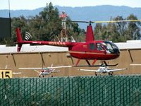 N9888S @ SQL - Red over Green 2007 Robinson Helicopter Company R44 II airborne @ San Carlos Muni, CA - by Steve Nation