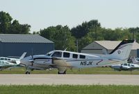 N5JK @ KOSH - Beech 58P