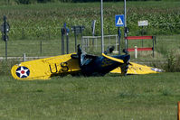 N56028 @ EBDT - Seconds after the crash. The Ryan came in, crossed the light poles and dived straight down. One severely and one lightly injured. The aircraft is a write off... - by Joop de Groot