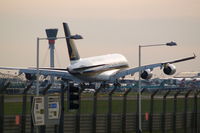 9V-SKA @ EGLL - Touching down rwy 27R