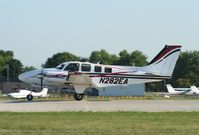 N282EA @ KOSH - Beech 58 - by Mark Pasqualino