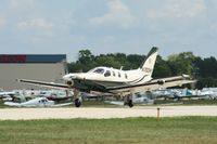 N700WE @ KOSH - Socata TBM 700 - by Mark Pasqualino
