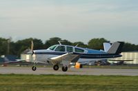 C-GXJX @ KOSH - Beech V35B - by Mark Pasqualino