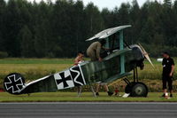 SE-XXZ @ ESKD - Builder and pilot Mikael Carlson getting into his replica Fokker Dr.1 (using the kitchen-stairs). - by Henk van Capelle