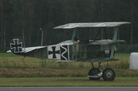 SE-XXZ @ ESKD - Builder and pilot Mikael Carlson taking off with his replica Fokker Dr.1 - by Henk van Capelle