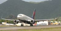 N301DQ @ TNCM - departing runway 28. out boun to the us