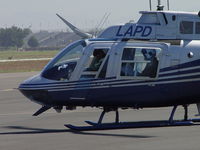 N3202Q @ POC - Appear to be checking maps or aircharts - by Helicopterfriend