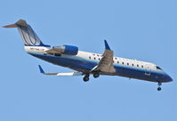 N571ML @ KORD - United Express/Mesa Airlines Canadair CL-600-2B19, N571ML RWY 10 approach KORD - by Mark Kalfas