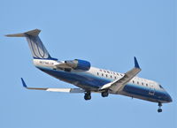 N571ML @ KORD - United Express/Mesa Airlines Canadair CL-600-2B19, N571ML RWY 10 approach KORD - by Mark Kalfas
