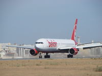 HB-ISE @ LPFR - A big plane waited by some spotters in FARO