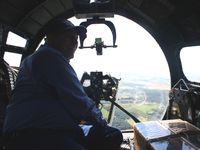 N3193G @ I74 - That's Dad, a WW2 Navy veteran checking out the bombardier's perch at 2500' over western Ohio. - by Bob Simmermon