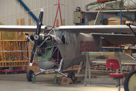 G-AEXD @ EGBK - Aeronca 100 hangared at Sywell - by Terry Fletcher