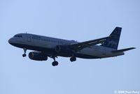 N570JB @ IAD - Devil with a blue dress on glding over the parking lot