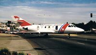 2115 @ KSAN - Dassault HU-25A c/n 419. (Stopping the traffic on Harbor Drive) - by Noel Kearney
