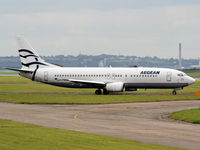SX-BLM @ EGGP - Aegean Airlines - by Chris Hall