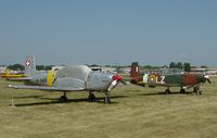 N848AD @ OSH - P3-05 (N848AD) and a P3-03 at Oshkosh 2006 - by Eric Bartsch
