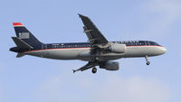 N123UW @ KLAX - Landing 24R at LAX - by Todd Royer