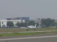 N9301N @ POC - Touching down on 26L - by Helicopterfriend