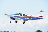 N36TN @ KOSH - Departing OSH on 27 - by Todd Royer